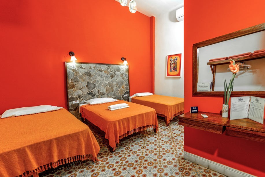 The Orange room in La Gargola guesthouse in Old Havana, Cuba